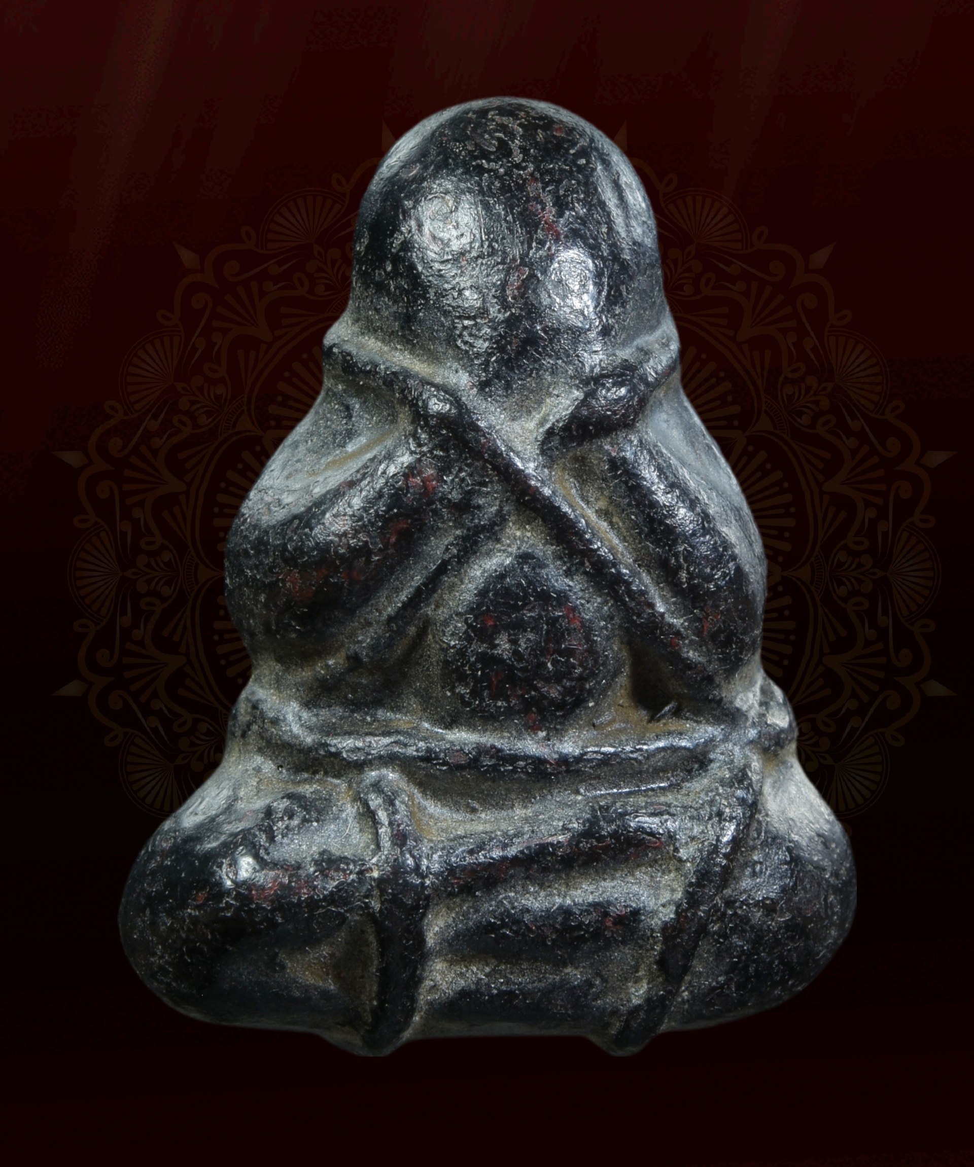 พระปิดตาผูกเชือก เนื้อผงคลุกรัก