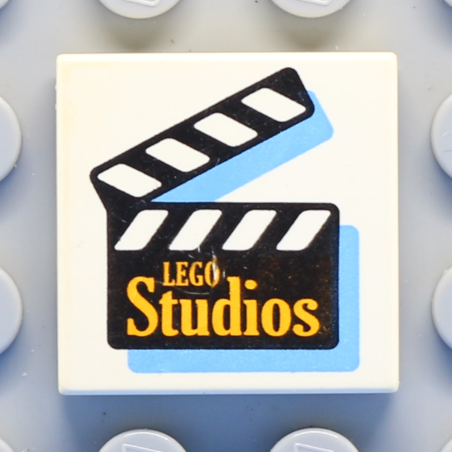 Tile 2 x 2 with Groove with Orange 'LEGO Studios' on Film Slate Pattern